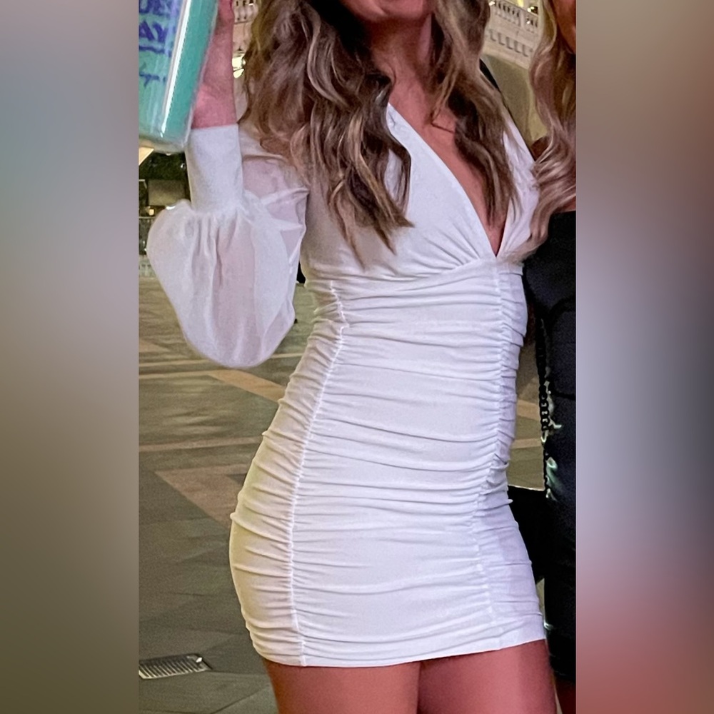 Plunging White Dress, very flattering doesn’t ride up, worn twice in college